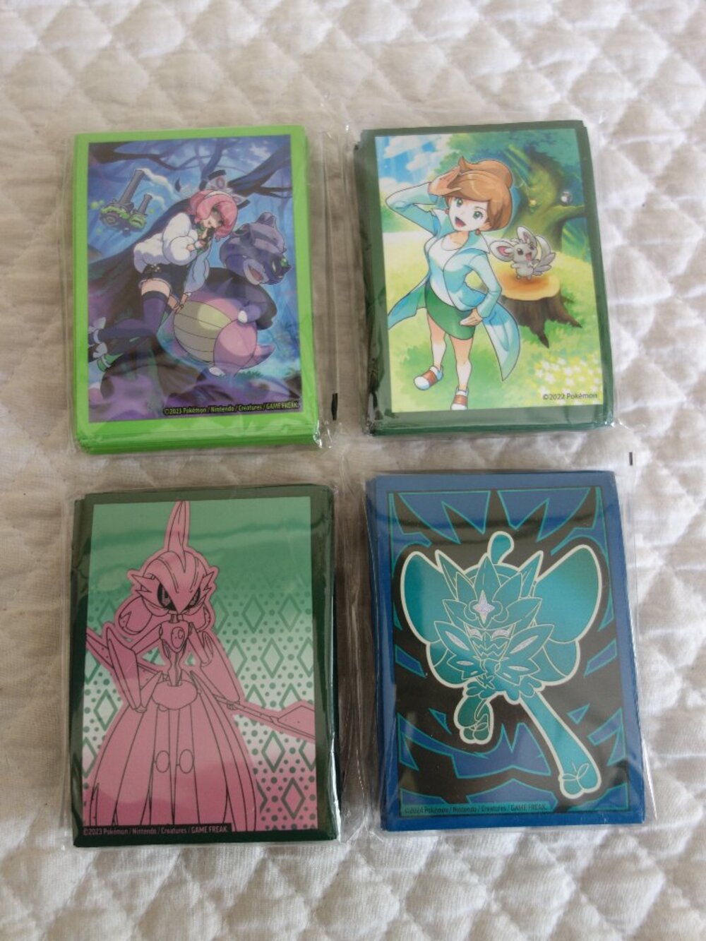 (g)	Lot of 4 NIP 65 count ea POKEMAN Trading Card Sleeves